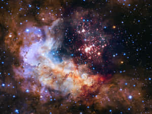一個色彩繽紛的星雲，充滿了深空中的星星。 — 月色夜空 壁紙