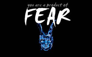 藍色發光兔頭骨，嵌有面孔，下方是文字 you are a product of FEAR。