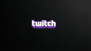 Twitch 標誌，白色和紫色文字在黑色紋理背景上