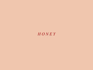 在桃色背景上以紅色文字顯示的單詞 honey。 — 彩色 壁紙