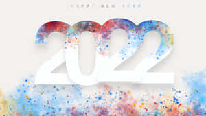 米色背景上色彩繽紛的油漆飛濺，新年快樂2022