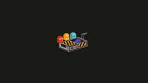 四個 Pac-Man 鬼魂在黑暗背景中的一個小手推車上。 — 簡約美學筆電 壁紙