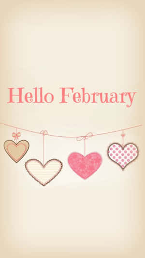 四個圖案心形掛在繩子上，下方有 'Hello February' 文字。 — 二月 壁紙