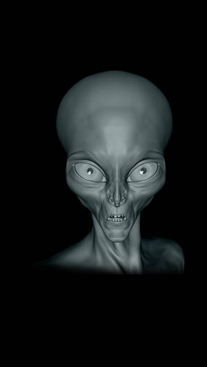 黑色背景上，灰色外星人臉部，有大眼睛和尖牙。 — 外星人 壁紙