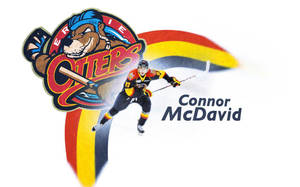 冰球運動員 Connor McDavid 與 Erie Otters 球隊標誌和彩虹軌跡一起移動。 — 麥拿侖 GIF 壁紙