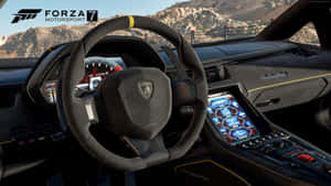 Forza Motorsport 7 電玩遊戲中林寶堅尼跑車的內部，帶有發光藍色控制裝置和山景。