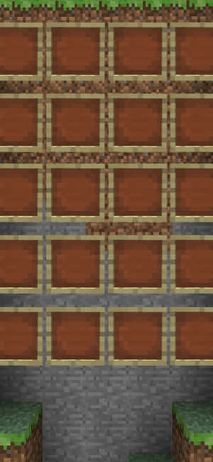 Minecraft泥土方塊喺網格中，下面有石頭同草方塊。 — iPhone 16e 壁紙