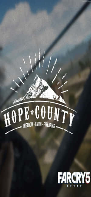 車窗上的Hope County標誌，帶有山脈和太陽爆發圖形。 — POCO F7 Pro 壁紙
