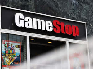 GameStop 店舖門面，櫥窗內有 Mario 遊戲海報 — 遊戲 壁紙