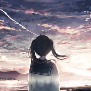 穿著水手服的動漫女孩看著海洋上的日落和鳥兒