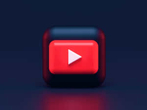 深藍色背景上帶有紅色光芒的亮面YouTube播放按鈕圖標。 — YouTube 壁紙