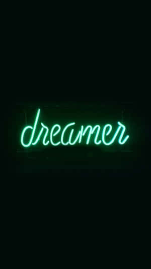 一個發光的綠色霓虹燈牌，在黑色背景上寫著dreamer。 — 霓虹美學 壁紙