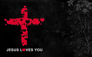紅色心形十字架，帶有文字 Jesus Loves You，位於帶有花卉漩渦的深色紋理背景上。 — 耶穌基督 壁紙