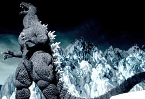 巨大的哥斯拉站在雪山頂上，在夜間咆哮。 — 哥斯拉 王者巨獸 壁紙