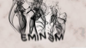 煙霧在米色紋理背景上形成 Eminem 的名字。