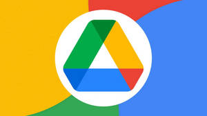 色彩繽紛抽象背景上的 Google Drive 標誌
