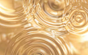 帶有柔和亮點的同心圓金色液體漣漪。 — 金色 壁紙