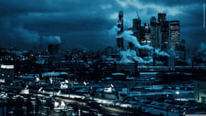 夜晚積雪的城市天際線，帶有煙霧和發光的街燈。 — 夜晚 GIF 壁紙