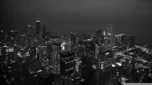 夜間燈火通明城市的黑白航拍照片，高樓林立。 — 黑白藝術 壁紙