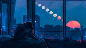 人坐在窗邊觀看月亮在夜間城市上空升起