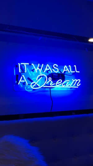 藍色霓虹燈牌，上面寫著「It Was All A Dream」，在昏暗的房間裡。