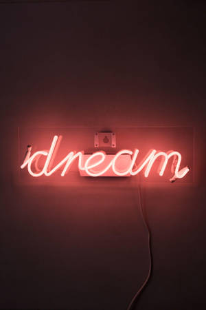 安裝在暗牆上，寫有「dream」的紅色霓虹燈牌。 — 紅色美學 壁紙