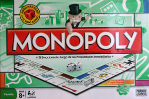 Monopoly棋盤遊戲盒，帶有戴高帽的吉祥物和西班牙文字。