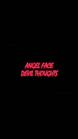 黑色背景上顯示 angel face devil thoughts 的紅色霓虹燈文字。
