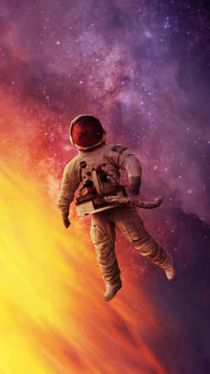 太空人在色彩繽紛的宇宙星雲中漂流，伴隨著星星 — 太空人 壁紙