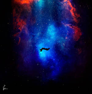 一個人在充滿星星的彩色星雲中漂浮。