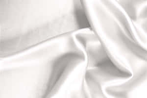 柔軟白色緞面布料，帶有柔和皺褶和光線反射。 — 白色美學gif 壁紙