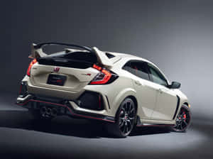 白色本田Civic Type R跑車，帶有黑色和紅色飾件，在工作室燈光下。