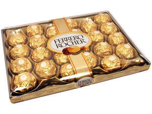 一盒金色箔紙包裝的 Ferrero Rocher 朱古力。 — 金色美學 GIF 壁紙