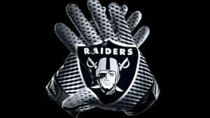 Raiders 美式足球手套，隊徽清晰可見。 — 掠奪者 壁紙