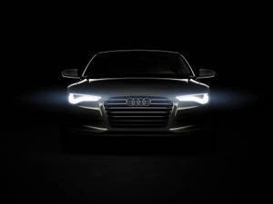 Audi 汽車正面，在黑暗的攝影棚中車頭燈閃耀 — Audi R8 GIF 壁紙