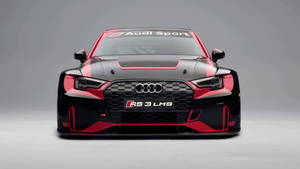 黑色和紅色 Audi RS 3 LMS 賽車在工作室環境中。 — Audi R8 GIF 壁紙