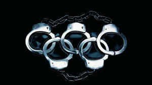 黑色背景上由手銬組成的奧運五環。