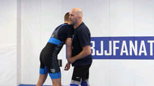 BJJ教練在訓練期間指導運動員 — 摔角 GIF 壁紙