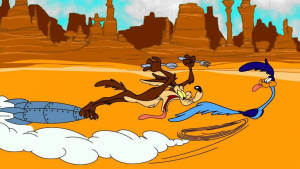 Wile E. Coyote 背著火箭，在沙漠中追逐 Road Runner。