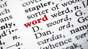 字典頁面中「word」一詞以紅色墨水突出顯示。 — 紅色 壁紙