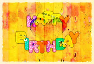 在水彩背景上帶有咕嚕眼睛的happy birthday文字。