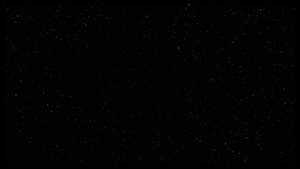 深邃的黑色虛空背景下，充滿了無數遙遠星星的星空夜空。