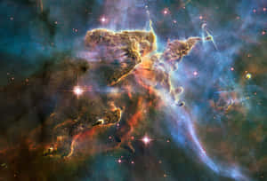 深邃太空中閃爍的恆星和旋轉的氣體雲組成的鮮豔宇宙星雲。 — 史詩 壁紙