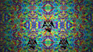 對稱的萬花筒圖案，帶有鮮豔色彩的惡魔形象。 — 迷幻 壁紙