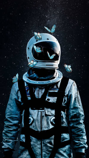太空人身穿太空衣，在星空背景下被藍色蝴蝶環繞。 — 太空人 壁紙