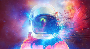 太空人頭盔在色彩繽紛的星雲背景下散發宇宙能量光芒。 — 太空人 壁紙