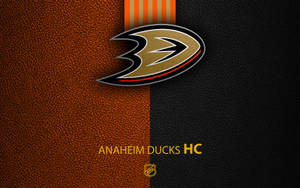 Anaheim Ducks HC 標誌在橙色和黑色皮革背景上