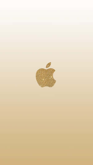 閃閃發光的金色Apple標誌在米色漸變背景上。 — 蘋果 壁紙
