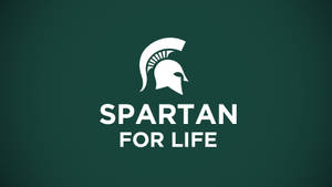 斯巴達頭盔標誌，附有文字 Spartan for Life，置於綠色背景上。