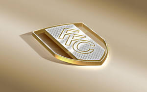 米色背景上的金銀 FTC 盾牌標誌。